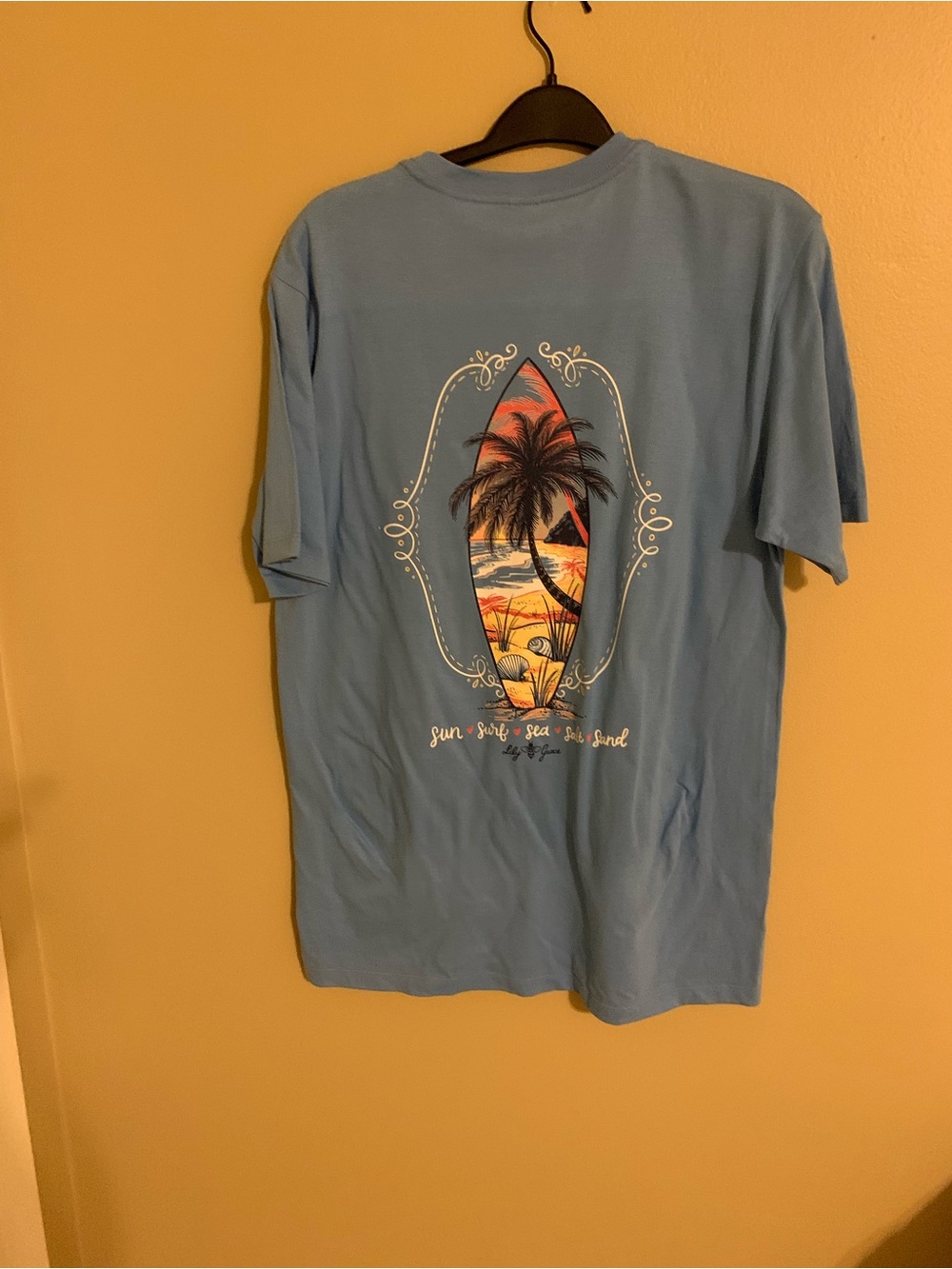 Women’s Light Blue Surf Graphic Short Sleeve Tee